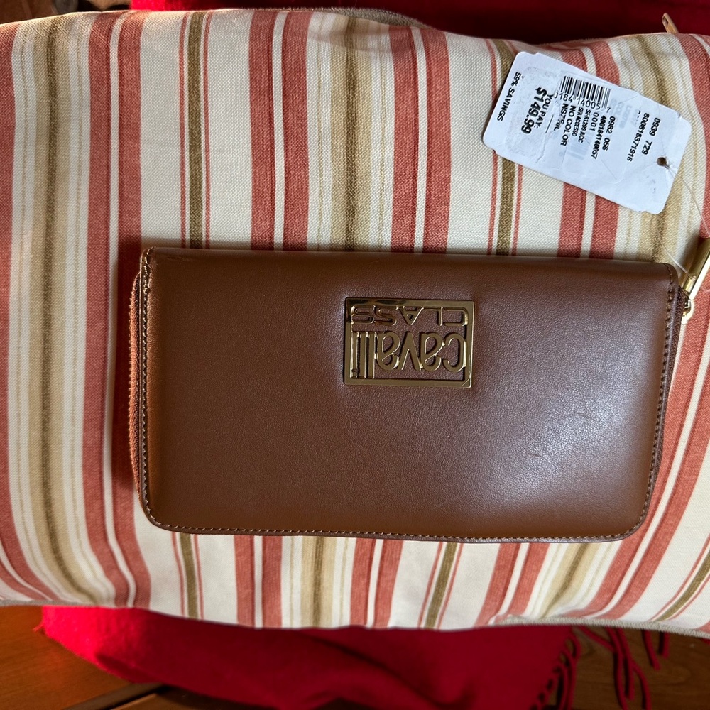 Brand New Roberto Cavalli lady’s wallet from Saks Fifth Ave.  asking $90
